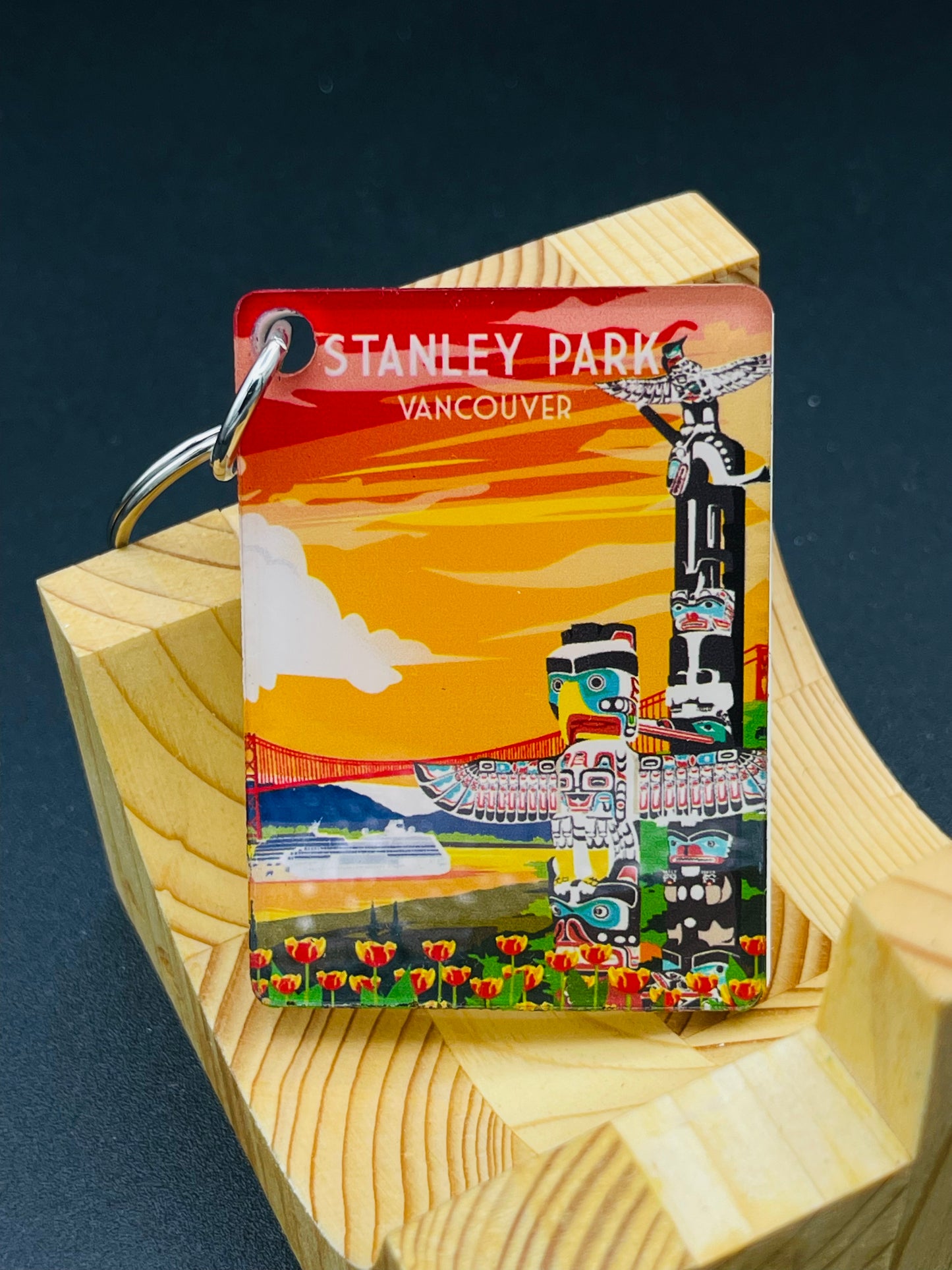 Art key chain featuring Stanley Park in Vancouver, Canada, by New Klondike Arts and Media, showcasing vibrant park imagery.