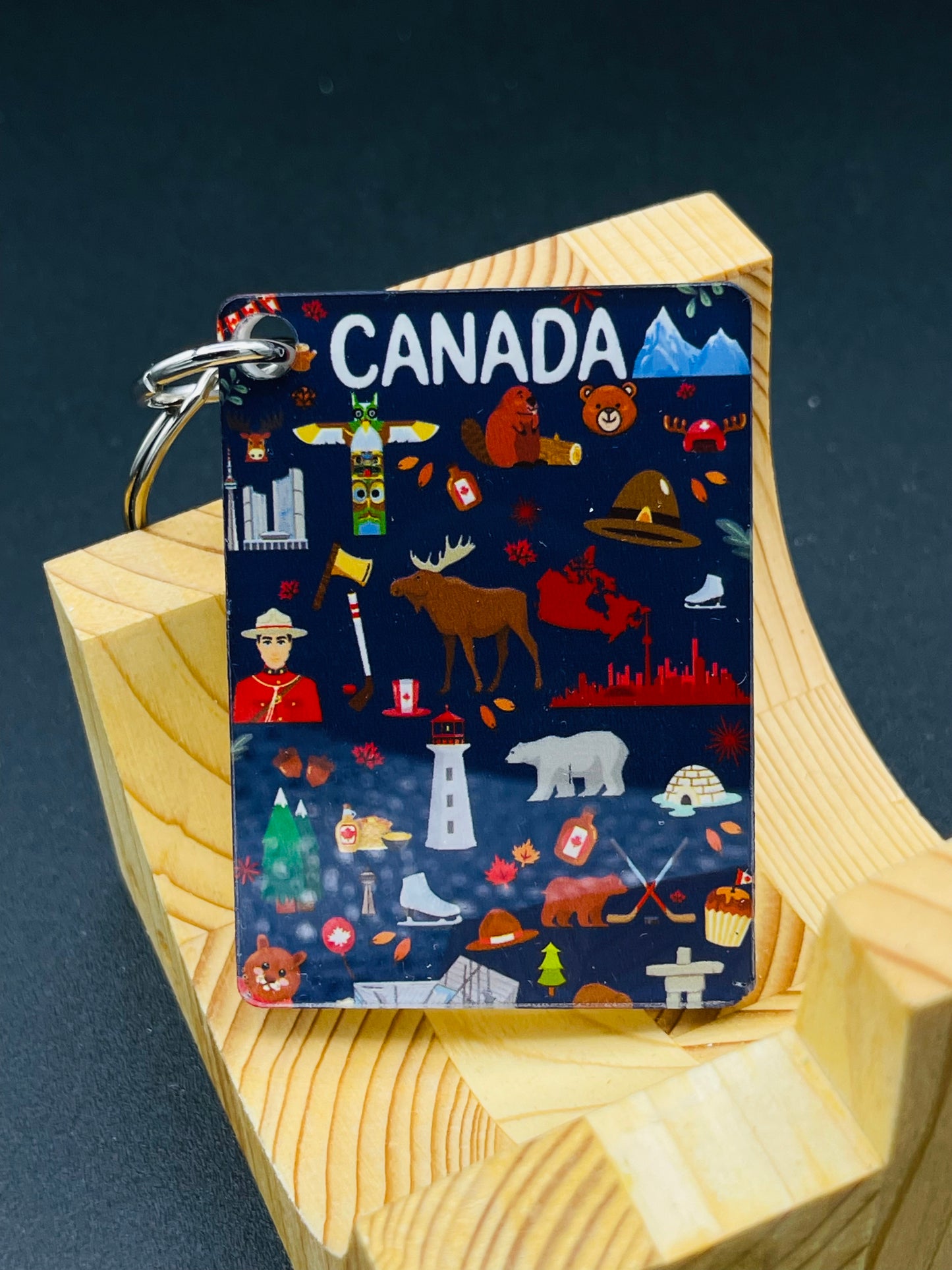 Canadian icons art key chain by New Klondike Arts and Media featuring vibrant, detailed designs on a small key chain accessory.
