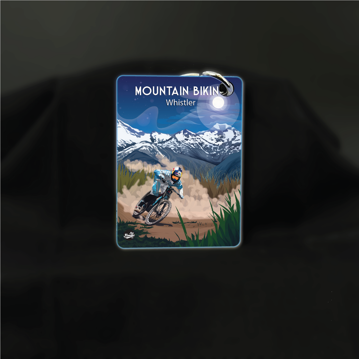 Art key chain featuring mountain biking scene at night by New Klondike Arts and Media, with a detailed mountain biking illustration.
