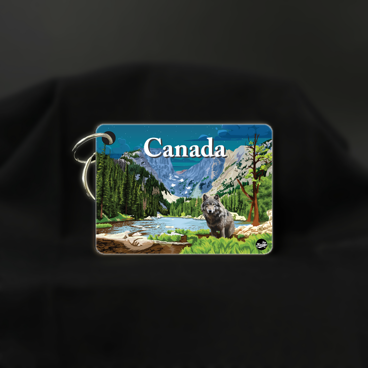 Canadian Rockies wolf key chain by New Klondike Arts and Media, featuring a detailed night scene wolf design.